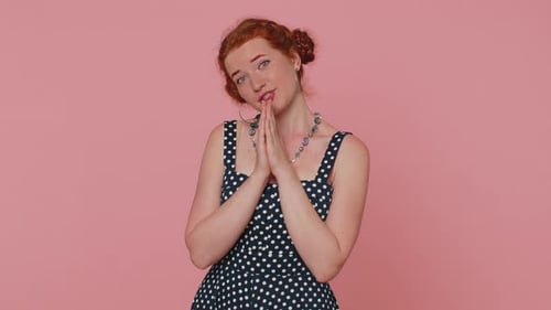 Woman Pleading, Apologizing, Clasping Hands