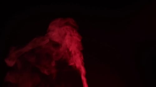 Red Smoke Wisps on Black Background