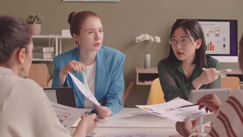 Multiethnic Businesswomen Having Meeting in Office