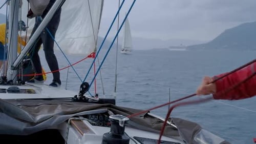 People Sailing on Yacht in Ocean on Cloudy Day