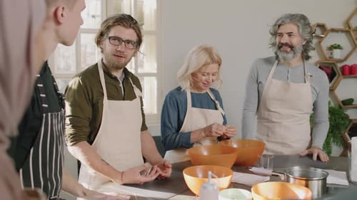 Group Attends Cooking Class in Sunny Kitchen