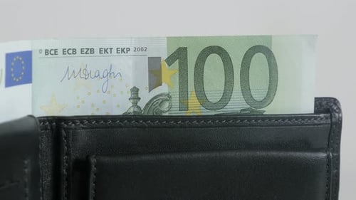 Close-up of Euro paper money in bi-fold leather case 3840X2160 UltraHD tilting footage - Modern blac