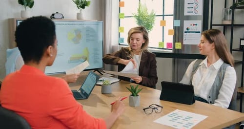 Business Team Collaborating on Data Analysis in Modern Office