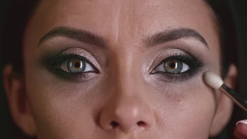 Woman Receives Eye Makeup Application Close Up