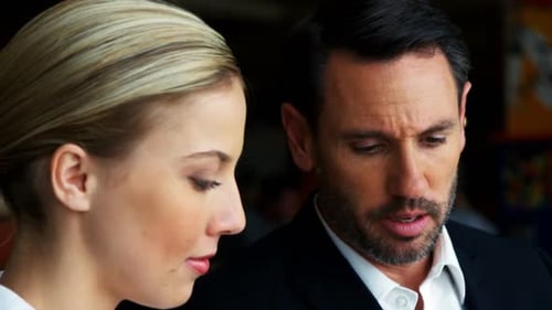 Business man and woman interacting with each other