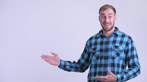 Man Presenting and Gesturing on White Backdrop
