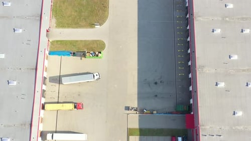 Aerial view of goods warehouse. Logistics center in industrial city zone from above. Aerial view of