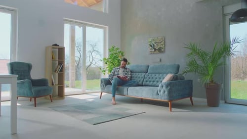 Married couple reading book together