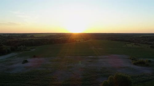 Aerial View Sunset or Sunrise in Field Drone Shot Beautiful Summer Sun in Forest
