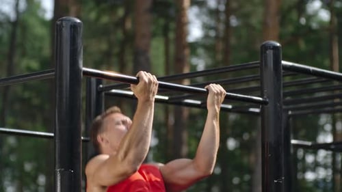 Athletic man Doing Chin Ups