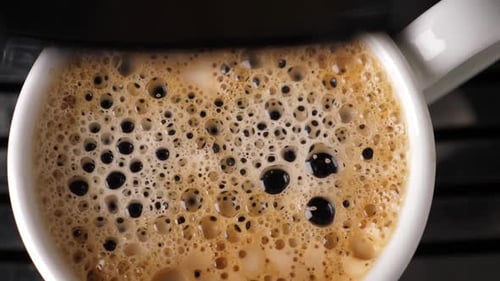Hot Coffee Pouring Into Mug, Bubbles