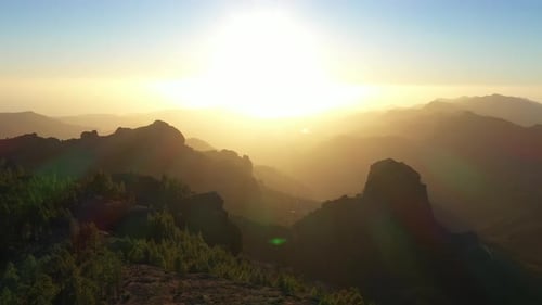 Drone Shot Of Sunset Over Misty Mountain Landscape