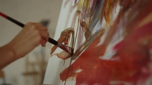 Close Up of Painter Painting on Canvas