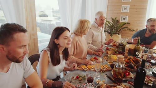 Family and Friends Gathering for Meal at Home