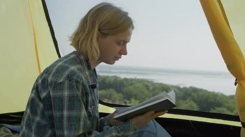 Girl Reading Book Inside Camping Tent