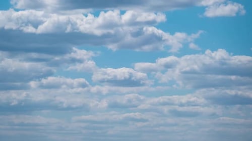 Cumulus Cirrus Clouds Move in the Blue Sky. Time Lapse.