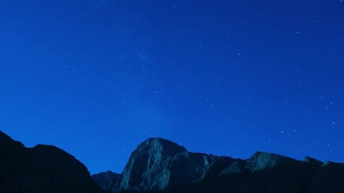 Star Time Lapse Over Dark Mountain Landscape