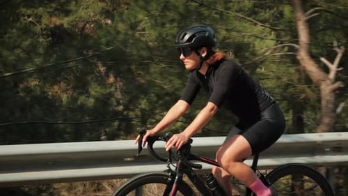 Cyclist riding bicycle in mountains