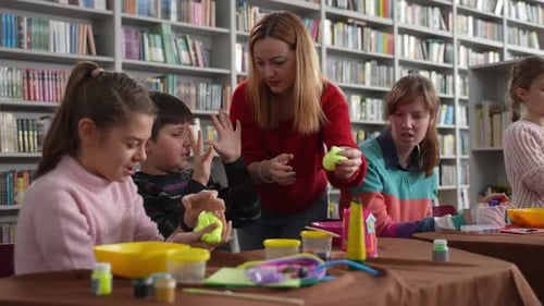 Children Creating Slime in Library with Instructor