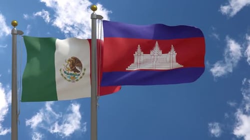 Waving Flags of Mexico and Cambodia on a Blue Sky