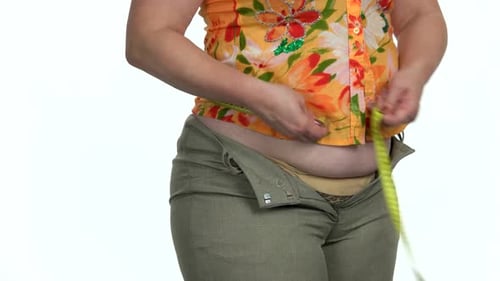 Overweight Woman Measuring Her Fat Belly