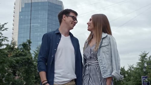 Affectionate Couple Kissing during Walk