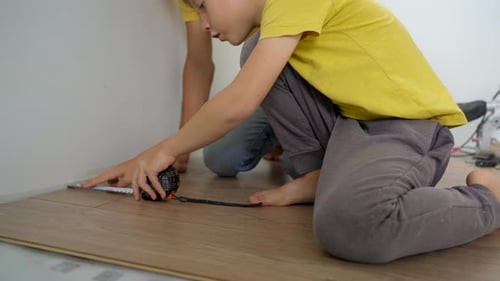 Child and Adult Measuring Flooring for Home Improvement