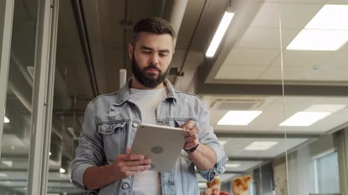 Serious Office Worker With Digital Tablet