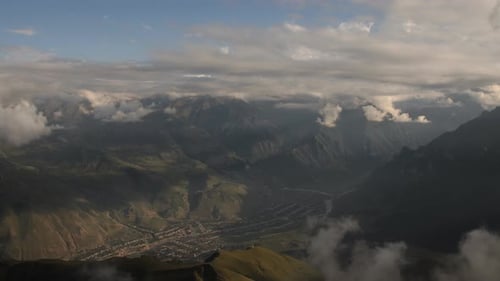 Time Lapse of Clouds Over a Village Located in a Mountain Gorge