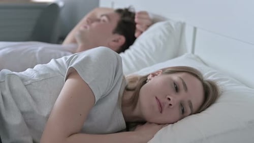 Unhappy Woman Feeling Sleepless in Bed