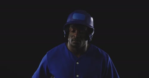 Baseball Player With Bat on Dark Background