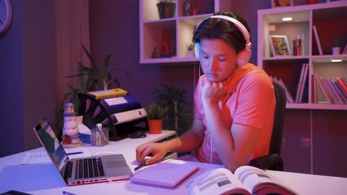 Teen Studying, Working on Laptop at Night