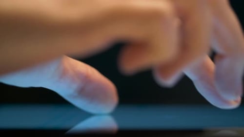 Close Up of Hand Using Computer Touch Screen