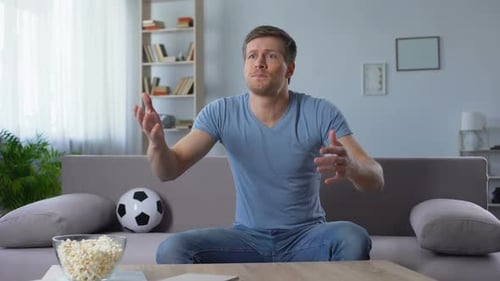 Man Watching Game on Couch