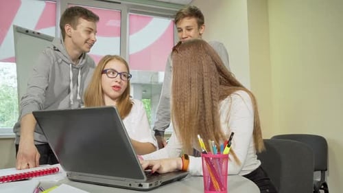 Group of Teenagers Discussing Assignment, Studying Together at School
