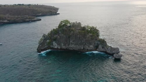 Tropical Nusa Penida Island and Turquoise Waters with Waves Crashing Against the Rocks