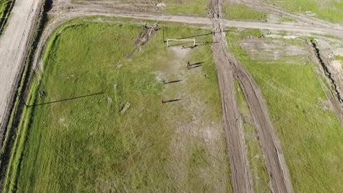 Top View Little Boys Playing Soccer on Green Field