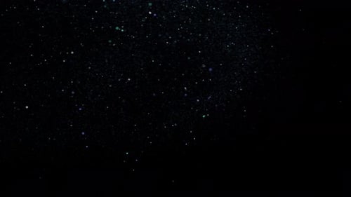 Glitter particles on a dark background