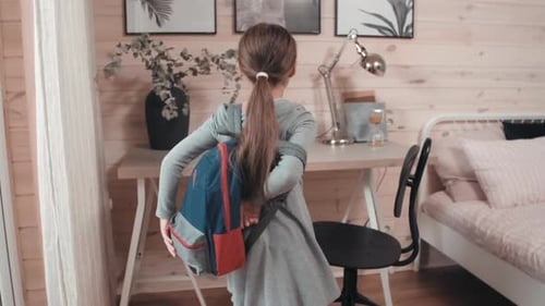 Young Girl with Backpack in Bright Home