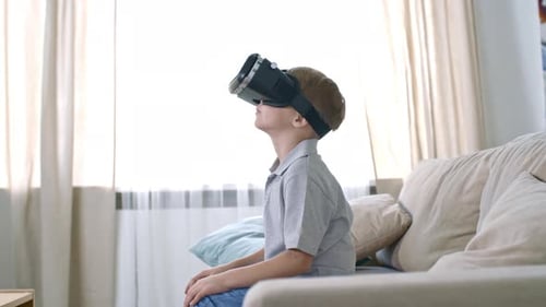 Boy Using Virtual Reality Headset at Home
