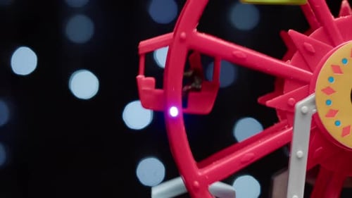 Ferris Wheel Toy Rotating on Black Background