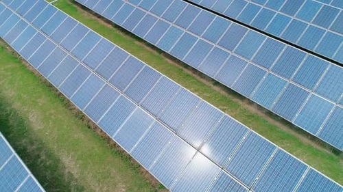 Aerial View of Solar Panels Farm Solar Cell with Sun Reflections