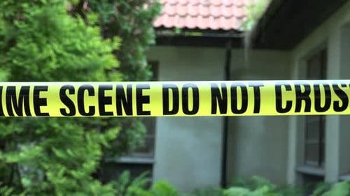 Crime Scene Tape in a Residential Yard