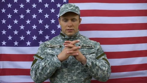 Soldier in Uniform in Front of American Flag