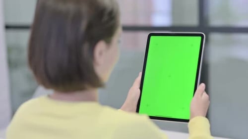 Woman Holding Tablet with Green Screen Technology