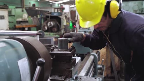 Smart Factory Worker Using Machine in Factory Workshop
