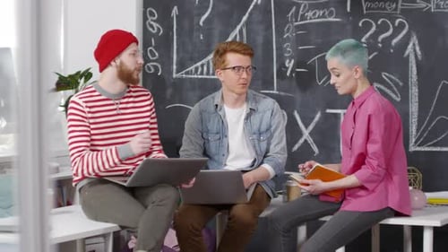 Caucasian Colleagues Having Work Meeting in Creative Office