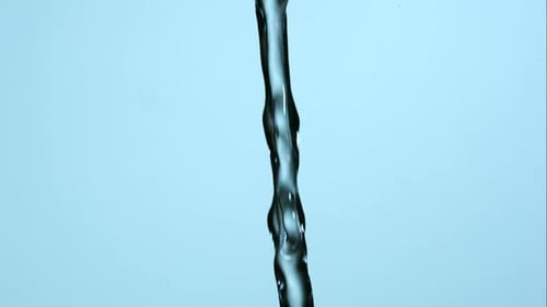 Water pouring and splashing in ultra slow motion 1500fps on a reflective surface - WATER POURS