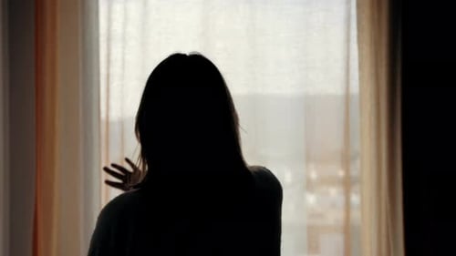 Woman in Hotel Room Opens Curtains and Walks Balcony Beautiful City View