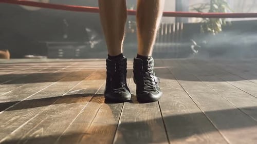 Boxer Jumping Rope in Boxing Ring for Training